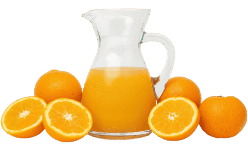 A clear glass pitcher filled with orange juice, surrounded by whole and halved fresh oranges on a solid teal background.