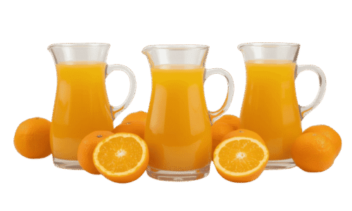 A clear glass pitcher filled with orange juice, surrounded by whole and halved fresh oranges on a solid teal background.