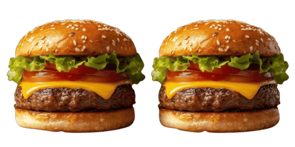 Two cheeseburgers side by side on a solid teal background, each with a sesame seed bun, beef patty, melted cheese, tomato slices, red onion, pickles, and leafy lettuce.