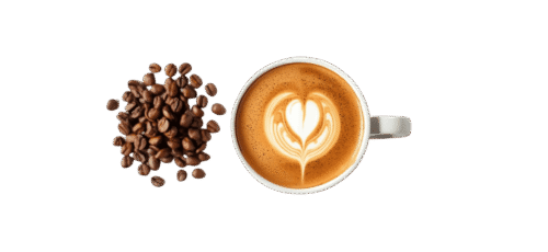 Top view of a latte coffee cup with heart-shaped latte art, placed beside a pile of roasted coffee beans on a plain background.