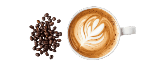 Top view of a latte coffee cup with heart-shaped latte art, placed beside a pile of roasted coffee beans on a plain background.